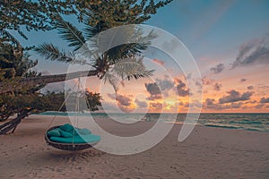 Exotic beach sunset landscape with beach swing, romantic couple destination scenic