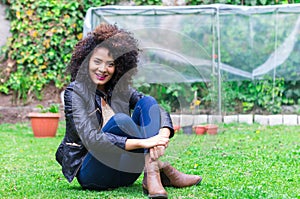 Exotic beautiful young girl relaxing in the garden