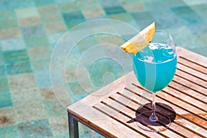 Exotic cocktail by the pool of a luxury hotel