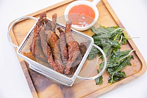 Deep fried Sundries beef served in the basket photo