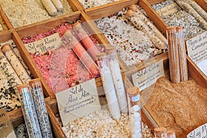 Exotic flavored salts with celery, Moroccan roses and other herbs for sale at a local farmers market in Nice, France