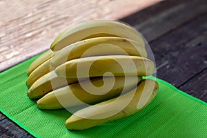 Exotic fresh bananas on wooden background