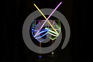 Exotic fresh transparent liquor beverages in wine glass with dark background for party celebration, new year, bar and christmas