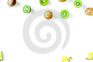 Exotic fruit design with kiwi on white background top view mock
