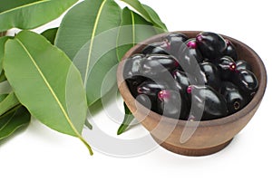 Exotic fruit Syzygium cumini called in Brazil as jamelÃ£o in wood bowl background