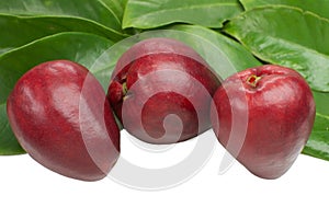 Exotic fruit Syzygium malaccense with leaves in white background