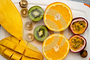 Exotic fruits on white cutting board