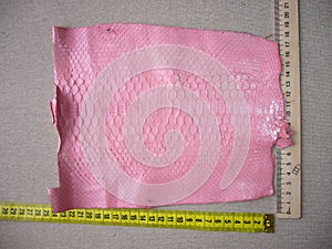 Exotic haberdashery leather, python skin, snake skin. Pink leather for accessories.