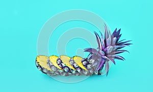 Exotic of pineapple slice on pastel color background.