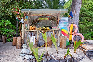 Exotic summer beach bar with mixed fruits on tropical island.