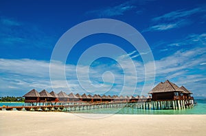 Exotic wooden huts on the water, Maldives