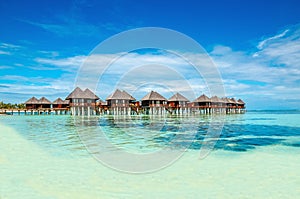 Exotic wooden huts on the water, Maldives