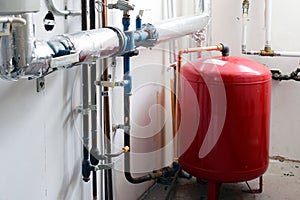 Expansion tank and pipelines in boiler room