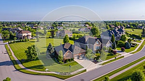 Expansive Aerial View of Lush Suburban Neighborhood with Curving Streets