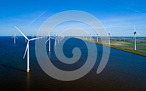 An expansive body of water in the Netherlands Flevoland is dotted with numerous towering windmills,