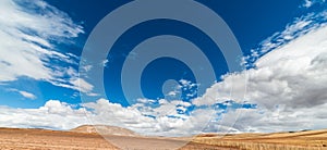 Expansive view of the Sacred Valley, Peru from Pisac Inca site, major travel destination in Cusco region, Peru. Dramatic sky.