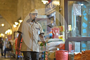 Expatriate cleaning worker in Souq Wakif, Doha