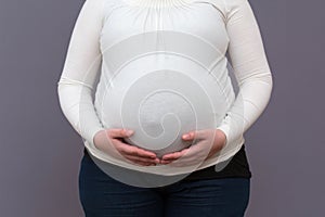 Expectant Mom Holding Growing Baby Bump