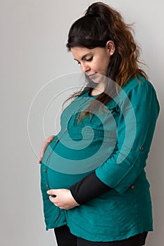 Expectant Mom Holding Her Budding Baby Bump