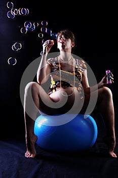 Expectant mother 40 weeks with soap bubbles