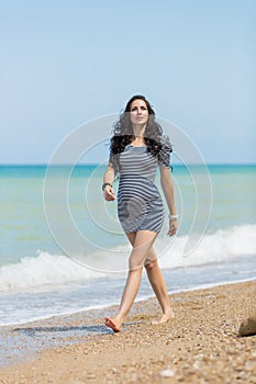 Expectant mother on the beach