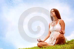 Expectant mother is meditating photo