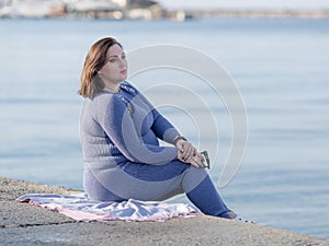 Expectant mother by the sea