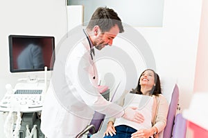 Expectant mother smiling in her routine checkup for her pregnancy