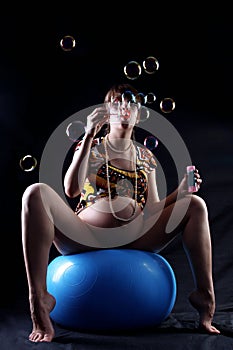 Expectant mother with soap bubbles