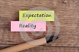 Expectation vs reality text on paper note
