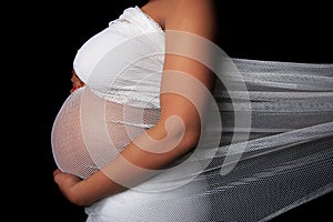 Expected mother wearing a white mesh cloth