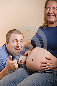 Expecting father giving the thumbs up