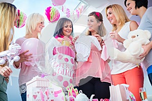 Expecting Mother with presents on baby shower party