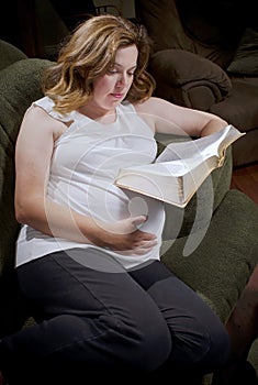 Expecting mother reads Bible