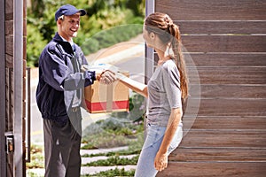 When she expects excellence she knows hell deliver the goods. a woman shaking hands with a friendly delivery man.
