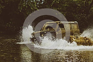Expedition offroader. Drag racing car burns rubber. Mudding is off-roading through an area of wet mud or clay. Extreme photo