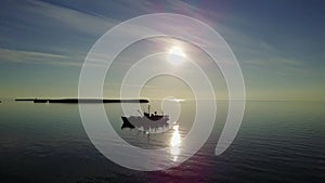 Expedition research ship on sunset background in Ocean on New Earth Vaigach.