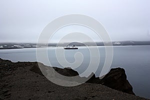 Expedition ship in the caldera of Deception Island, Antarctica