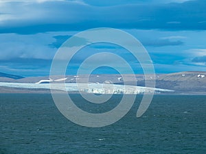 Expeditions cruise in the arctic ocean with view of die mountain landscape. Svalbard.