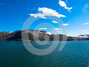 Expeditions cruise in the arctic ocean with view of die mountain landscape. Svalbard. photo