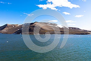 Expeditions cruise in the arctic ocean with view of die mountain landscape. Svalbard. photo