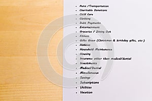 Expenses and Budget List with Wooden Background