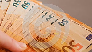 Expenses and incomes in EU.fifty euros banknotes pack. Euro currency exchange rate.Budget allocation.Money in hands.