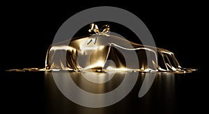 Expensive car gift covered by gold shiny fabric with bow-knot isolated on a black studio background.