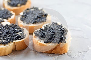 Expensive delicious black caviar white bread sandwich snack on w