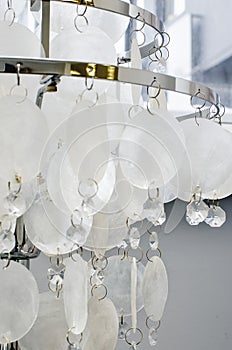 Expensive exquisite crystal chandelier in Classical style. Vertical photography