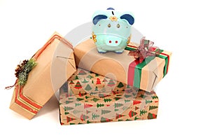 Expensive gifts and piggy bank isolated