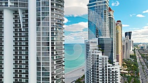 Expensive high rise hotels and condos on Atlantic ocean shore in Sunny Isles Beach city. American tourism infrastructure