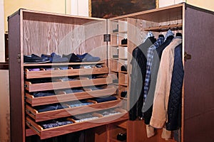 Expensive Men`s clothing and shoes in the closet