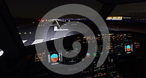 Airplane Cockpit View at Night Illuminated.